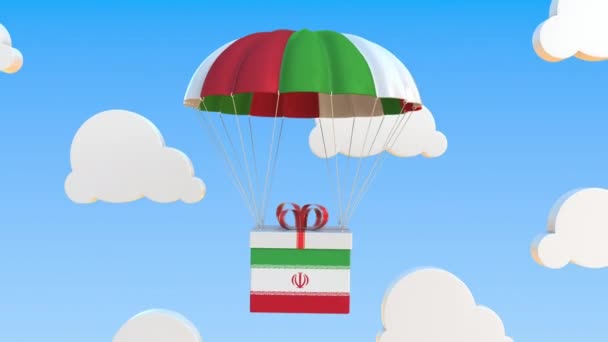 Karton met vlag van Iran valt met een parachute. Loopbare conceptuele 3D-animatie — Stockvideo