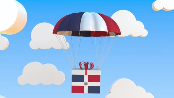 Doos met nationale vlag van de Dominicaanse Republiek valt met een parachute. Loopbare conceptuele 3D-animatie — Stockvideo