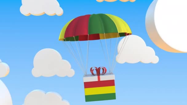 Scatola con bandiera nazionale della Bolivia cade con un paracadute. Animazione 3D concettuale Loopable — Video Stock