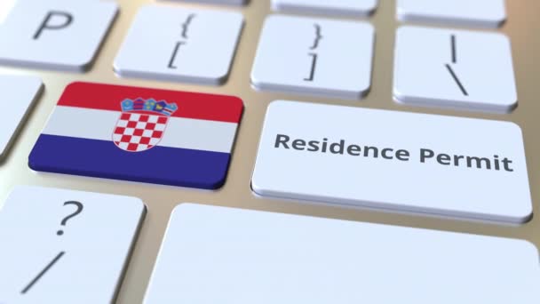 在计算机键盘上的按钮上有克罗地亚的居住许可文本和标志。 移民相关概念3D动画 — 图库视频影像