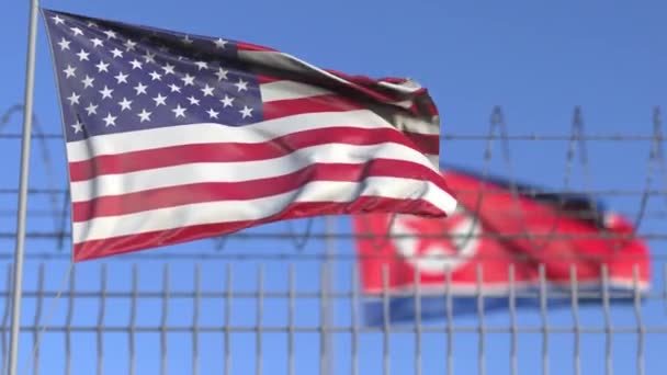 Waving flags of the USA and North Korea separated by barbed wire fence. Conflict related loopable conceptual 3D animation — 비디오