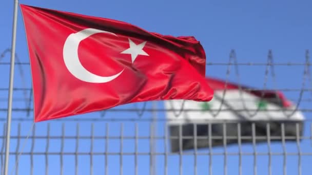 Waving flags of Turkey and Syria separated by barbed wire fence. Conflict related loopable conceptual 3D animation — Stock Video