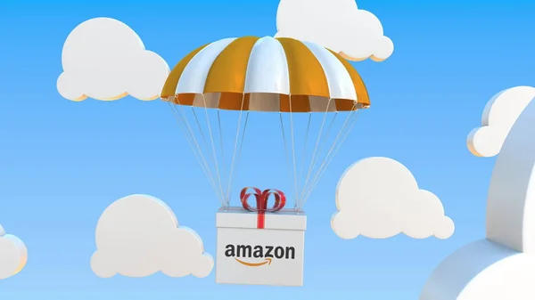 Doos met Amazon logo valt met een parachute. Redactionele 3d-weergave — Stockfoto