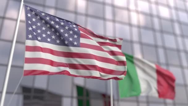 Waving flags of the United States and Italy in front of a modern skyscraper facade — Stock Video