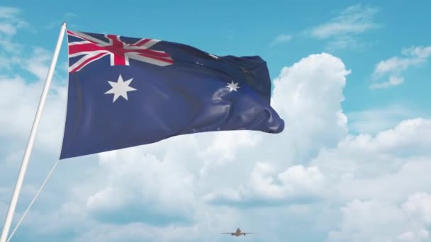 Avião comercial pousando atrás da bandeira australiana. Turismo na Austrália — Vídeo de Stock
