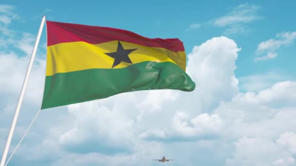 Airliner approaches the Ghanaian national flag. Tourism in Ghana — Stock Video