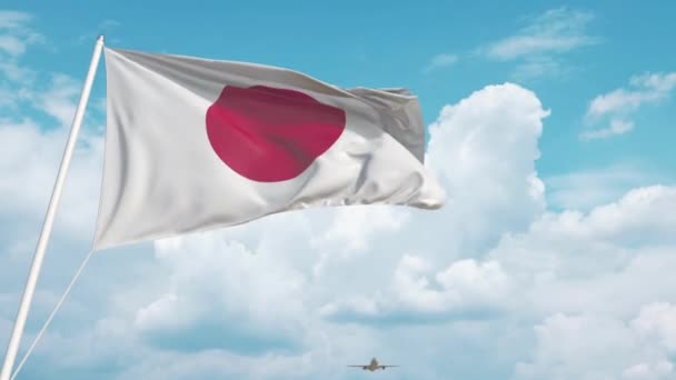 Самолет прибывает в аэропорт с флагом Японии. Туризм Японии — стоковое видео