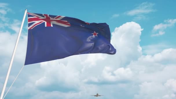 Airliner approaches the New Zealand national flag — ストック動画