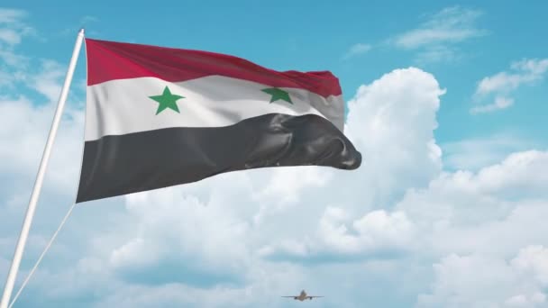 Obchodní letadlo přistávající za syrskou vlajkou. Cestovní ruch v Sýrii — Stock video