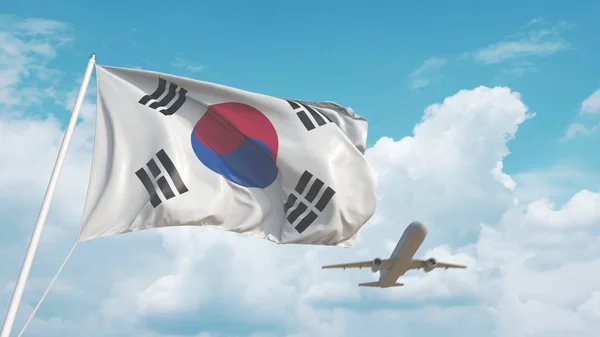 Avião comercial a aterrar atrás da bandeira coreana. Turismo na Coreia do Sul. Renderização 3D — Fotografia de Stock