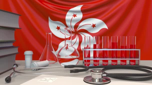 フラグの背景に診療所の研究室機器。香港における医療・医療研究関連の概念アニメーション — ストック動画