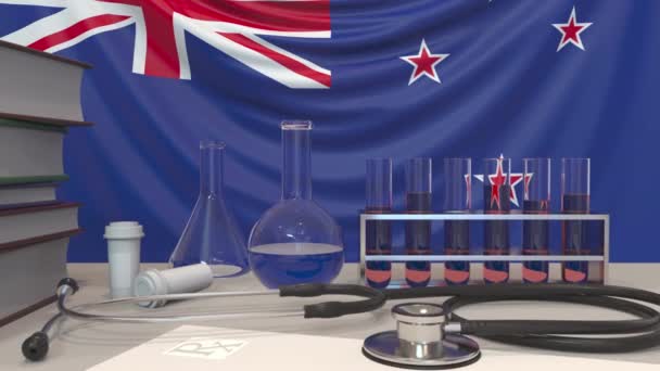 Attrezzature di laboratorio della clinica sullo sfondo della bandiera. Assistenza sanitaria e ricerca medica in Nuova Zelanda relative animazione concettuale — Video Stock