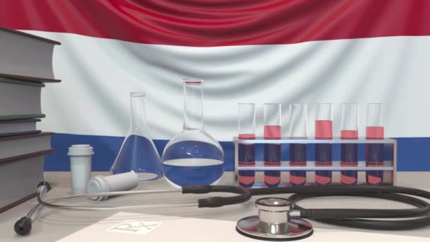 フラグの背景に診療所の研究室機器。オランダ関連の概念アニメーションのヘルスケアと医学研究 — ストック動画