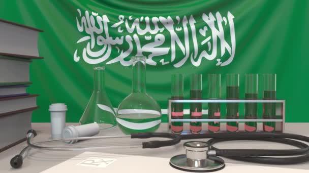 Clinic laboratory equipment on flag background. Healthcare and medical research in Saudi Arabia related conceptual animation — 비디오