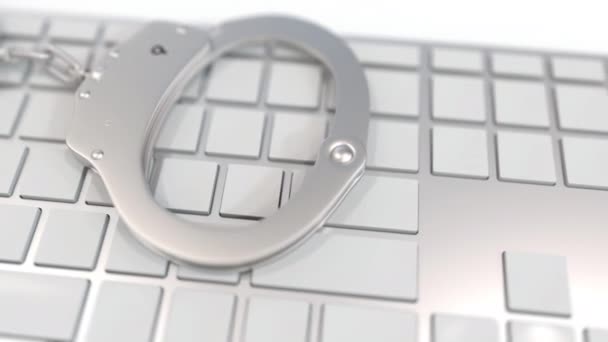 Handcuffs on keyboard with SPAM text on keys. Computer crime related conceptual 3D animation — 비디오
