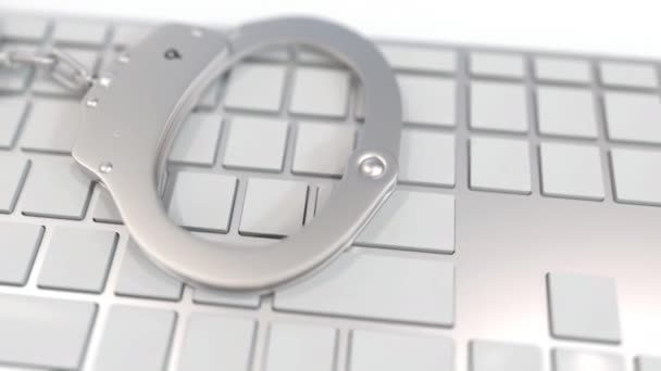 Handcuffs on keyboard with PORN text on keys. Crime related conceptual 3D animation — stockvideo © alexeynovikov #341985694