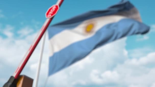 Closed boom gate on the Argentinean flag background. Restricted entry or certain ban in Argentina — ストック動画