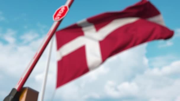 Closed boom gate on the Danish flag background. Restricted entry or certain ban in Denmark — 图库视频影像