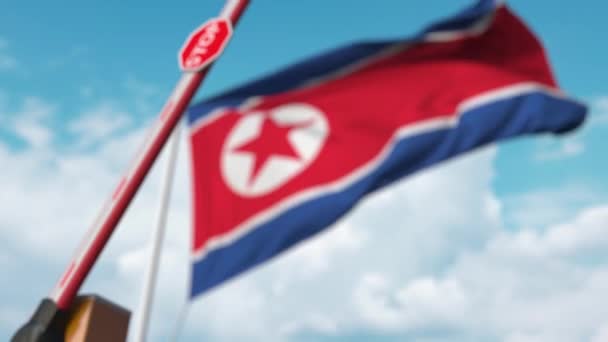 Closed boom gate on the North Korean flag background. Restricted entry or certain ban in North Korea — ストック動画