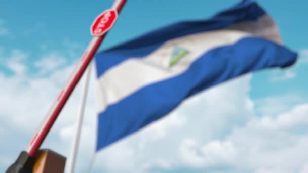 Barrier gate being closed with flag of Nicaragua as a background. Nicaraguan restricted border crossing or certain ban — 비디오