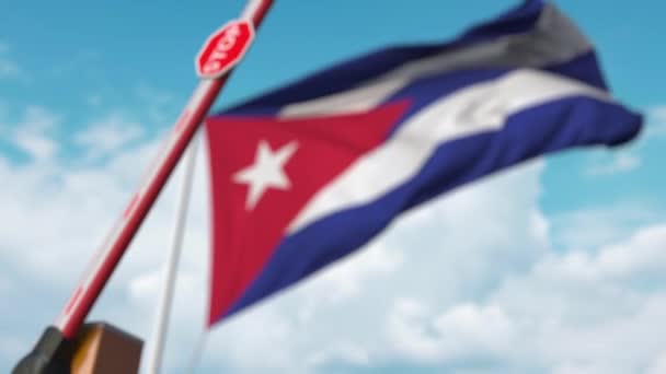 Closing boom barrier with stop sign against the Cuban flag. Restricted entry or certain ban in Cuba — Stockvideo