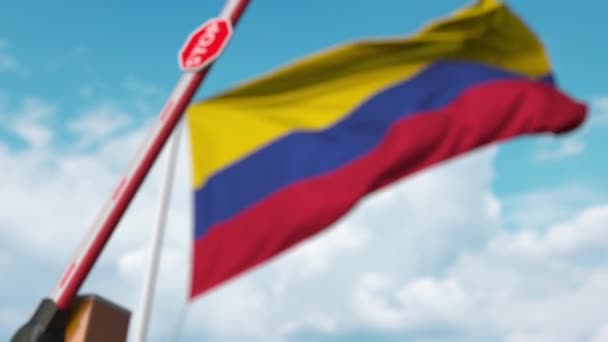 Closed boom gate on the Colombian flag background. Restricted entry or certain ban in Colombia — ストック動画