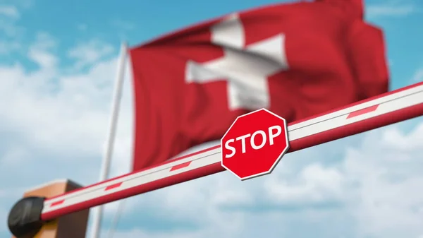 Закритий бар'єр з знаком "Стоп" проти швейцарського прапора. Обмежений кордон або певна заборона в Швейцарії. 3d рендеринг — стокове фото
