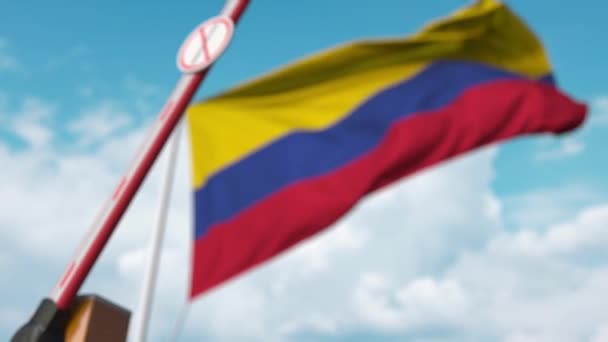 Closed boom gate with no immigration sign on the Colombian flag background. Border closure or immigration ban in Colombia — 비디오