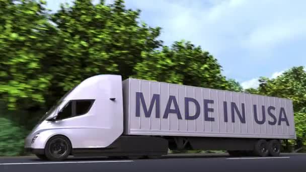 Camion semi-remorque électrique moderne avec texte MADE IN USA sur le côté. Animation 3D bouclable liée à l'importation ou l'exportation américaine — Video