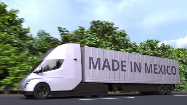 Σύγχρονη ηλεκτρικό ημι-ρυμουλκούμενο φορτηγό με Made In Mexico κείμενο στο πλάι. Μεξικανική εισαγωγή ή εξαγωγή που σχετίζονται με loopable 3d animation — Αρχείο Βίντεο