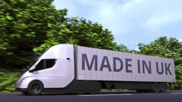 Трейлер с надписью MADE IN UK на боку. Британский импорт или экспорт связанной с петлей 3D анимации — стоковое видео
