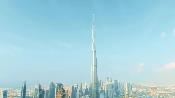 DUBAI, UNITED ARAB EMIRATES - DECEMBER 30, 2019. Aerial shot of the Burj Khalifa top on blue sky background — Stock Photo, Image