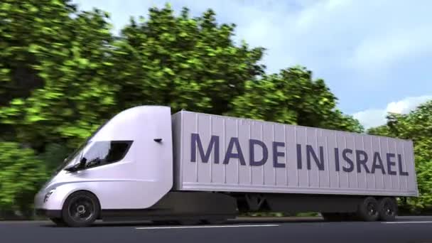 Camion semi-remorque électrique moderne avec texte MADE IN ISRAEL sur le côté. Importation ou exportation israélienne liée à l'animation 3D bouclable — Video