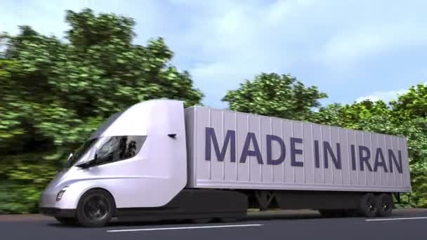 Modern elektrisk påhängsvagn lastbil med Made In Iran text på sidan. Iransk import eller export relaterade loopable 3d animation — Stockvideo
