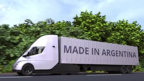 Yanında "Made in Argentina" yazan bir karavan. Arjantin ithalatı veya ihracatla ilgili 3d döngü animasyonu — Stok video