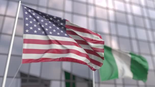 Waving flags of the USA and Nigeria in front of a modern skyscraper — Stock Video