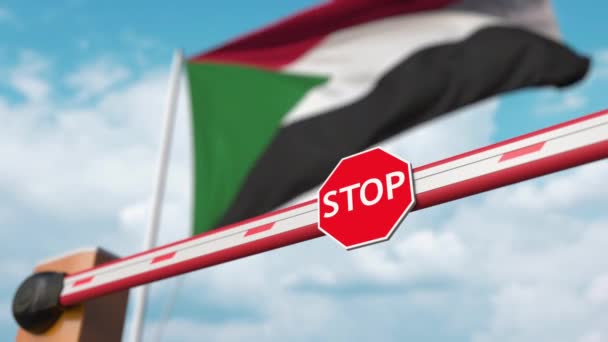 Open boom gate on the Sudanian flag background. Free border crossing or lifting a ban in Sudan — Stock Video
