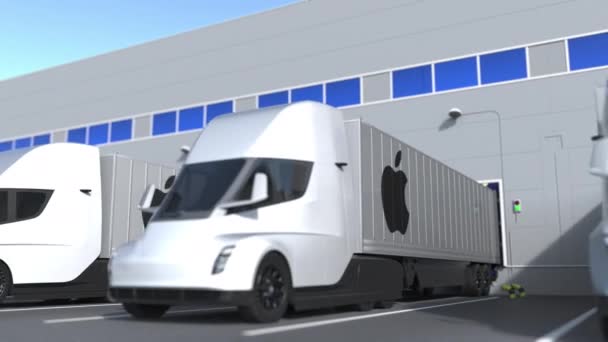 Trailer trucks met Apple Inc. logo worden geladen of gelost in het magazijn. Logistiek gerelateerde loopable 3d animatie — Stockvideo