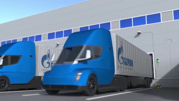Camiones semirremolques con el logotipo de Gazprom siendo cargados o descargados en el almacén. Animación 3D loopable relacionada con la logística — Vídeo de stock