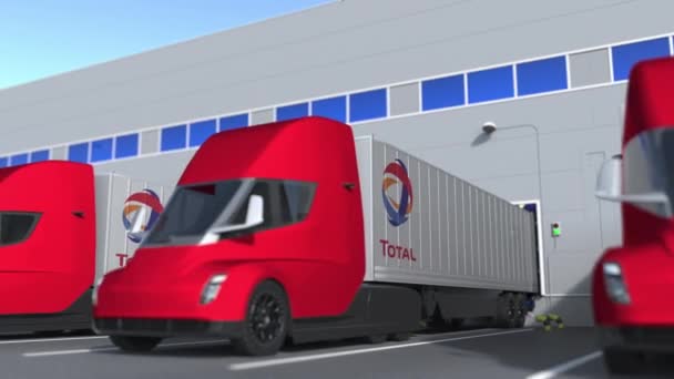 Depoda yüklü ya da boşaltılan tamamen savcılık logosu olan elektrikli karavan kamyonları. Lojistik bağlantılı 3d döngü canlandırması — Stok video