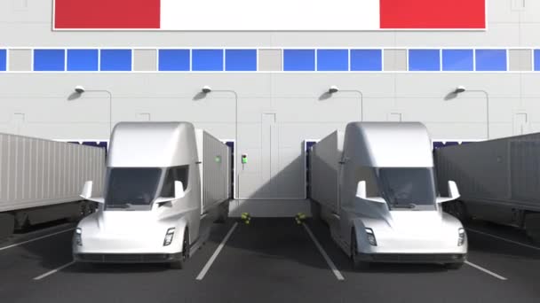 Electric semi-trailer trucks at warehouse loading dock with flag of CANADA. Canadian logistics related conceptual 3D animation — Stock Video
