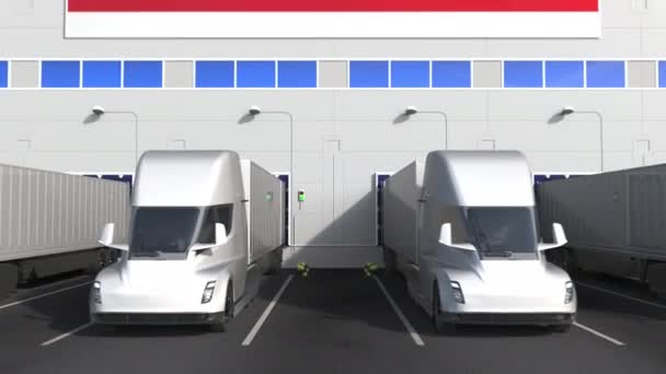 Ηλεκτρικά ημιρυμουλκούμενα φορτηγά στην αποβάθρα φόρτωσης αποθήκης με σημαία Μαλαισίας. Μαλαισίας logistics σχετικές εννοιολογική 3d animation — Αρχείο Βίντεο