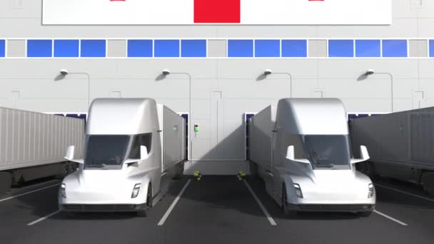 Trailer trucks at warehouse loading dock with flag of GEORGIA. Georgian logistics related conceptual 3D animation — Stock Video