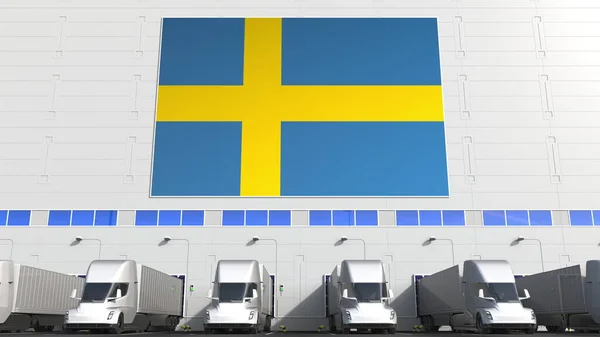 Trailer vrachtwagens op magazijn laden baai met vlag van Zweden. Zweedse logistiek gerelateerde conceptuele 3d-rendering — Stockfoto