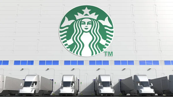 Elektromos félpótkocsik a raktár rakodóterében Starbucks logóval a falon. Szerkesztőségi 3D-s renderelés — Stock Fotó