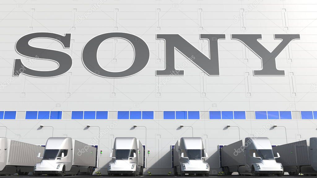 Trailer trucks at warehouse loading bay with logo on the wall. Editorial 3D