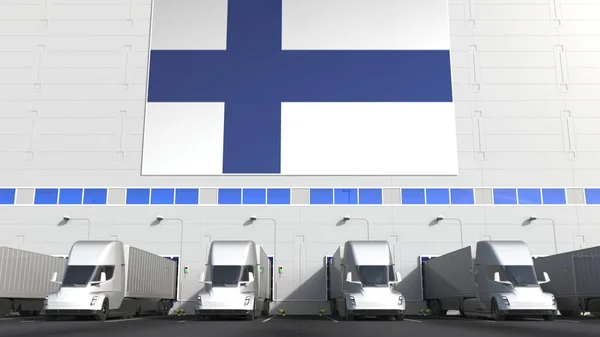 Elektrische oplegger vrachtwagens bij magazijn laadperron met vlag van Finland. Finse logistiek gerelateerde conceptuele 3d-rendering — Stockfoto