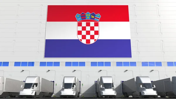 Camiones eléctricos en bodega de carga con bandera de CROACIA. Logística croata relacionada con la representación conceptual 3D — Foto de Stock