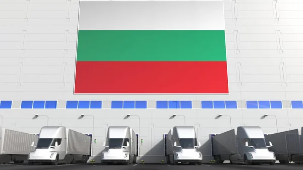창고에 있는 화물 트럭들 이 BULGARIA 의 깃발로 부두를 하역하고 있습니다. 불가리아어 물류는 개념 3D 렌더링 과 관련 이 있다. — 스톡 사진