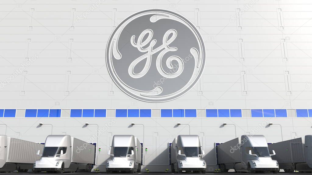Trailer trucks at warehouse loading bay with logo on the wall. Editorial 3D